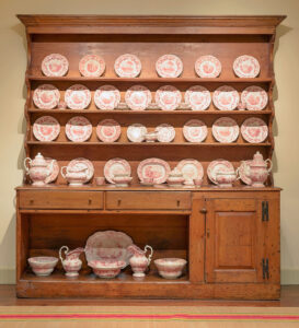 Pine dresser with pink Staffordshire pottery, New England, c. 1750–1790