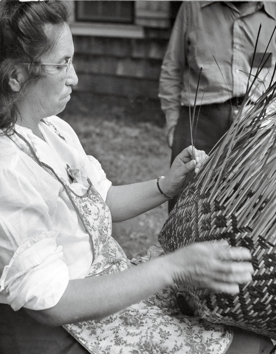 Lottie Stamper working on a double woven rivercane basket at the 1948 Craftsman’s Fair
