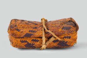 Once-known maker, basket with lid, Swain County or Jackson County, North Carolina, c. 1850. Rivercane, pigments, and cotton, 8 5⁄8 × 3 1⁄4 × 4 1⁄8 in. National Museum of the American Indian, Smithsonian Institution, Washington, DC, 1/9150